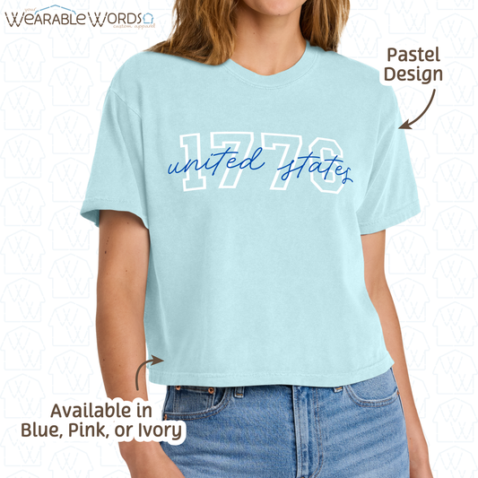 1776 United States Graphic Tee | Collegiate Cursive Blue & White Print | Women's Boxy T-Shirt